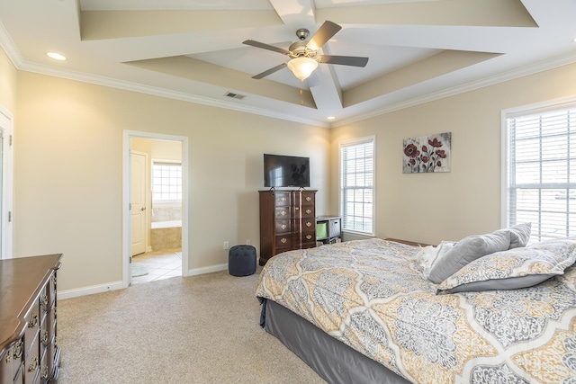 bedroom featuring visible vents, a raised ceiling, and multiple windows