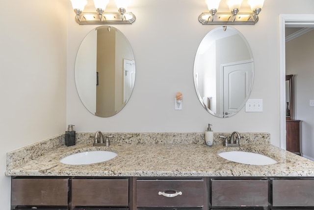 bathroom featuring double vanity and a sink