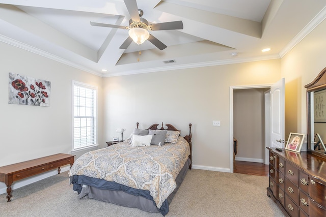 bedroom featuring a raised ceiling, baseboards, visible vents, and carpet floors