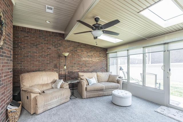 sunroom with ceiling fan, visible vents, and a skylight