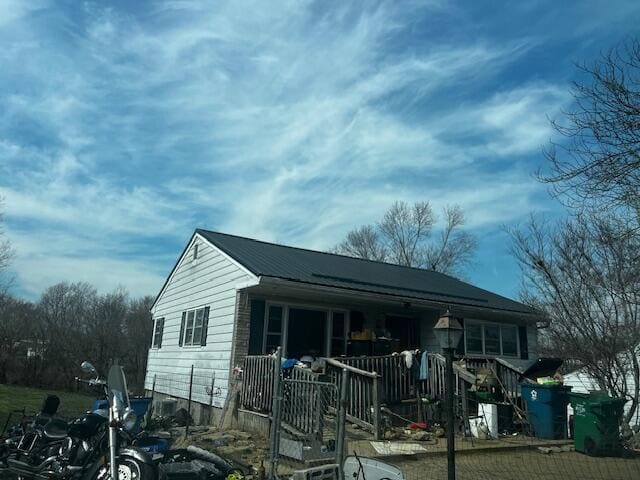 view of outbuilding featuring covered porch