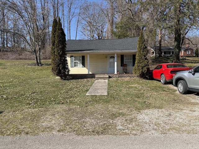 view of front of house with covered porch and a front yard