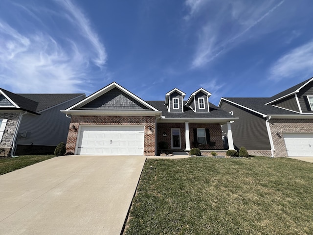 view of front facade with brick siding, a front lawn, a porch, driveway, and an attached garage