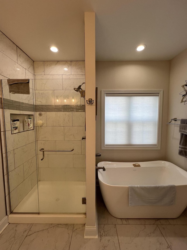 bathroom featuring a freestanding tub, recessed lighting, marble finish floor, and a stall shower