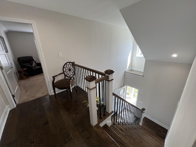 stairs with recessed lighting, baseboards, and wood finished floors