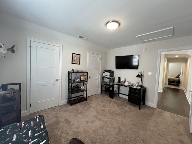 living room with visible vents, attic access, baseboards, and carpet floors