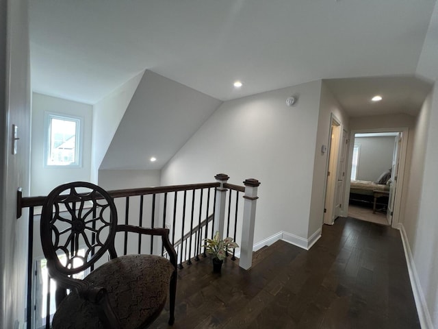 hall with recessed lighting, baseboards, an upstairs landing, and dark wood-style floors