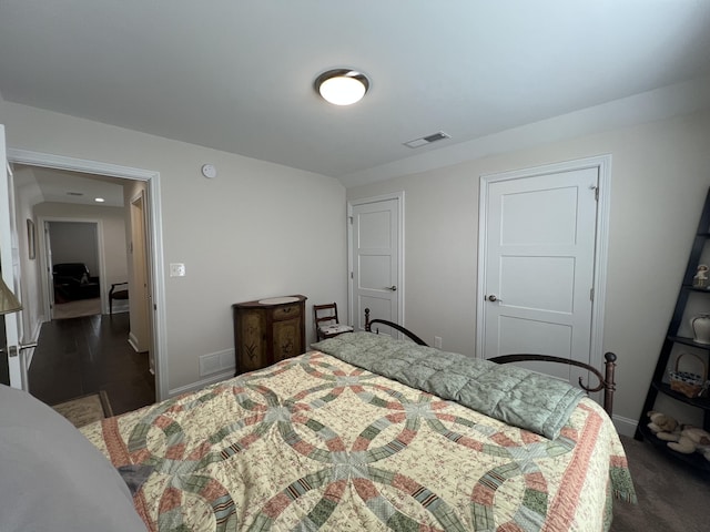 bedroom with visible vents and baseboards