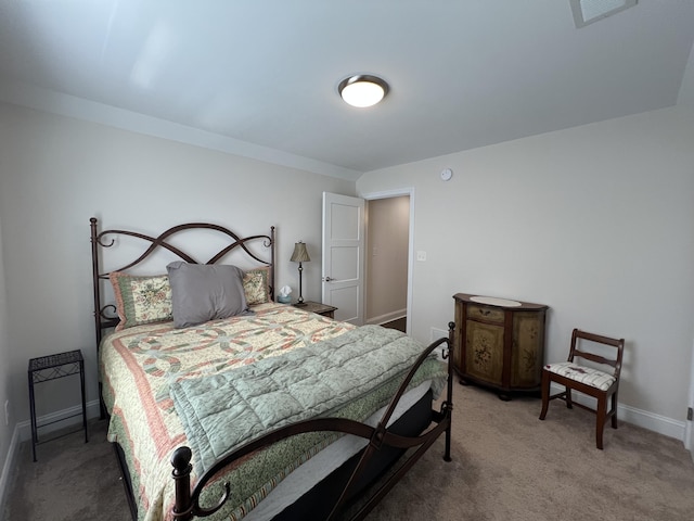 carpeted bedroom featuring visible vents and baseboards