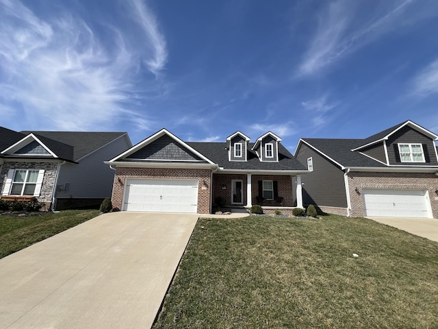 view of front of property featuring brick siding, an attached garage, a front lawn, a porch, and driveway