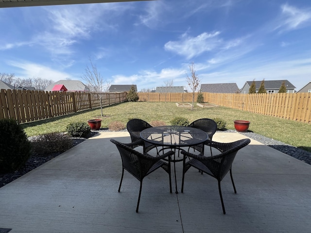 view of patio with outdoor dining area and a fenced backyard