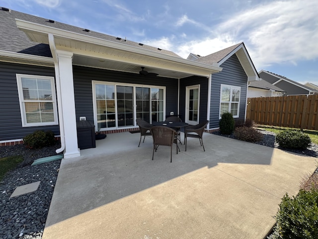 view of patio with a ceiling fan and fence