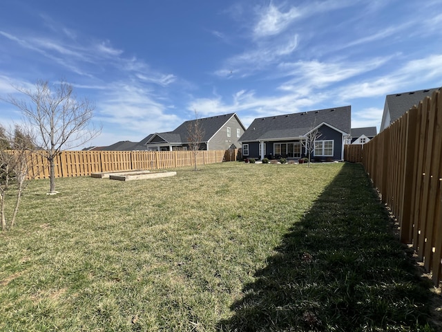 view of yard with a fenced backyard