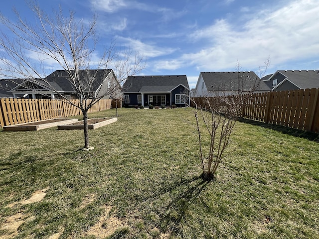 view of yard featuring a fenced backyard