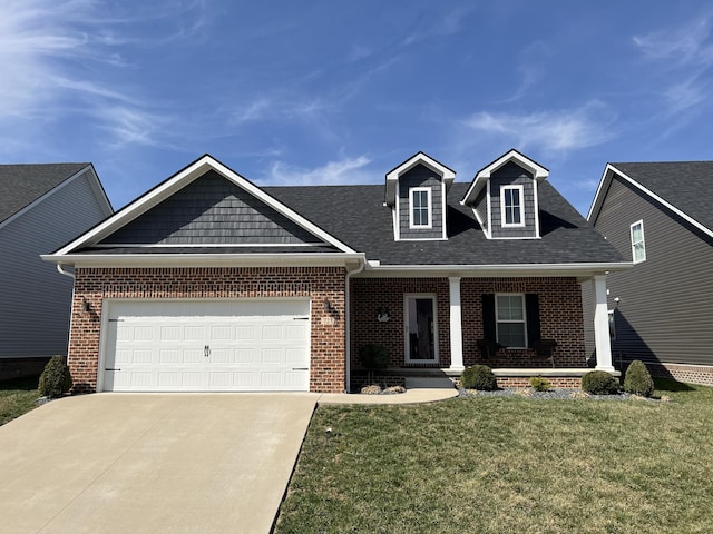 view of front facade with a front yard, brick siding, concrete driveway, and an attached garage