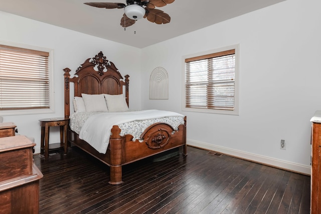 bedroom featuring visible vents, baseboards, and hardwood / wood-style flooring