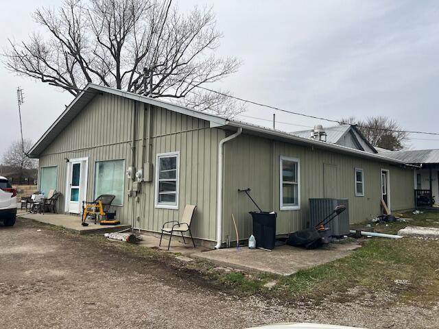 rear view of property featuring a patio area