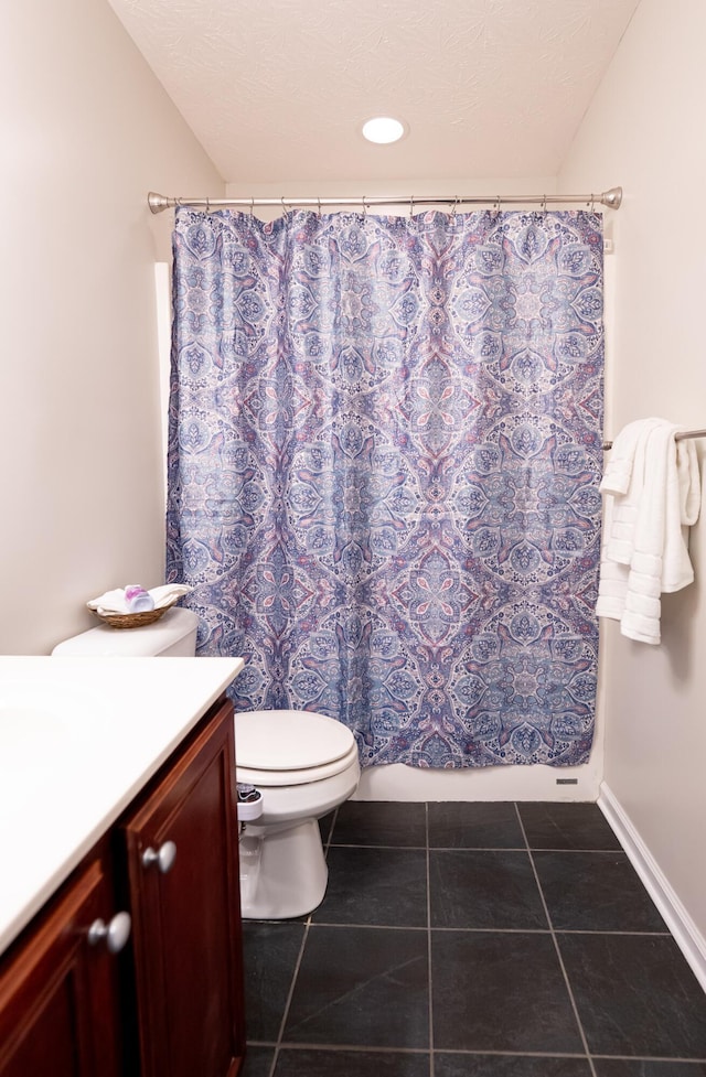 full bathroom featuring vanity, tile patterned floors, toilet, and baseboards