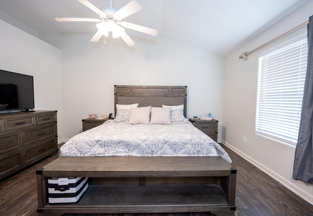 bedroom with a ceiling fan, lofted ceiling, dark wood-style floors, and baseboards