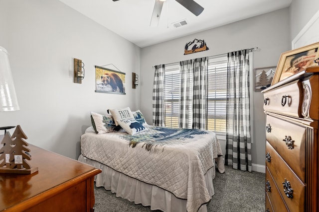 carpeted bedroom featuring a ceiling fan, visible vents, and baseboards