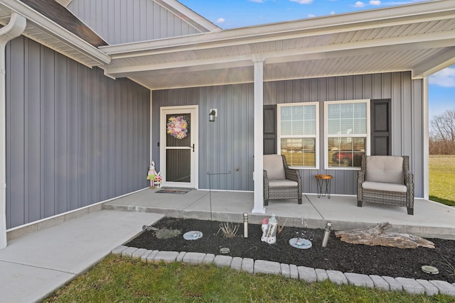 property entrance with a porch and board and batten siding