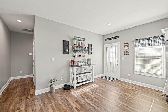 foyer with visible vents, recessed lighting, baseboards, and wood finished floors