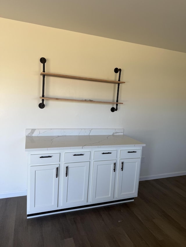 interior details with wood finished floors and baseboards