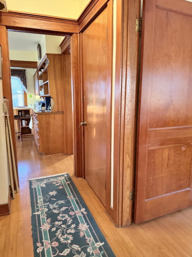 corridor featuring light wood-style floors