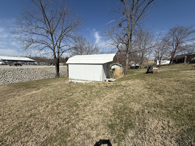 view of yard featuring an outbuilding and a storage unit