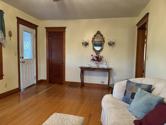 foyer featuring light wood-type flooring and baseboards