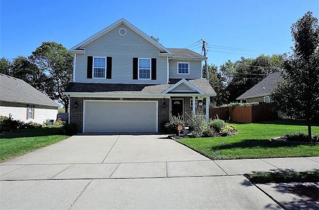 traditional-style home featuring driveway, fence, a front yard, a garage, and brick siding