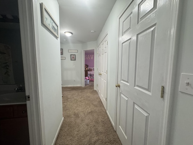 804 Orange Blossom Dr, Nicholasville, KY 40356 - hallway featuring baseboards, carpet floors, and a sink