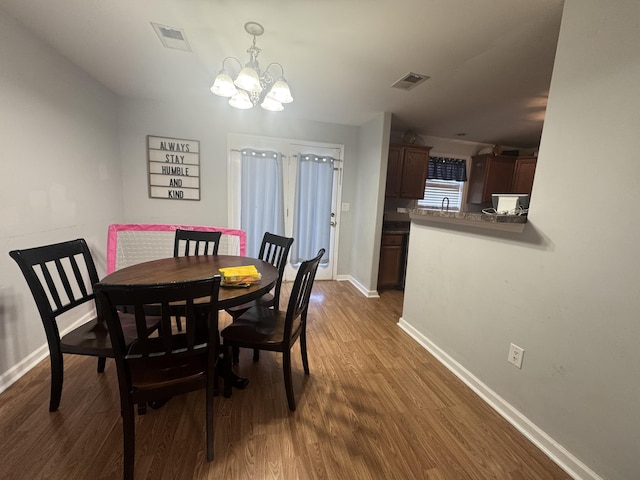 804 Orange Blossom Dr, Nicholasville, KY 40356 - dining room featuring a notable chandelier, visible vents, dark wood-type flooring, and baseboards