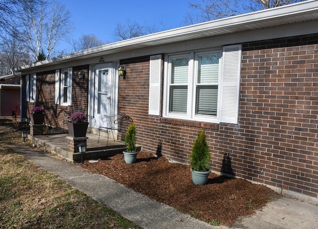 view of front of house featuring brick siding