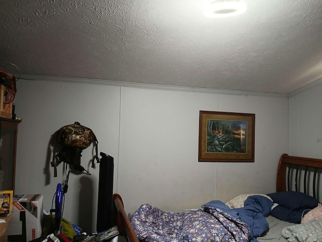 bedroom featuring a textured ceiling