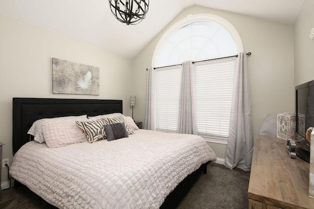 bedroom with lofted ceiling, carpet, and baseboards