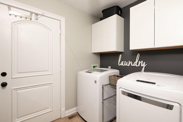 laundry area featuring cabinet space and washing machine and dryer