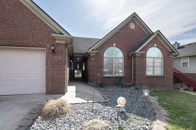 single story home featuring brick siding and a garage