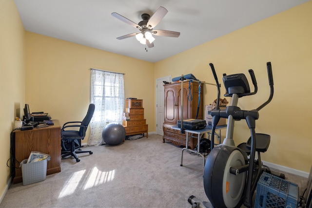 office area featuring a ceiling fan, baseboards, and carpet floors