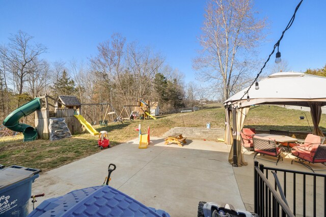 view of patio with a gazebo and a playground