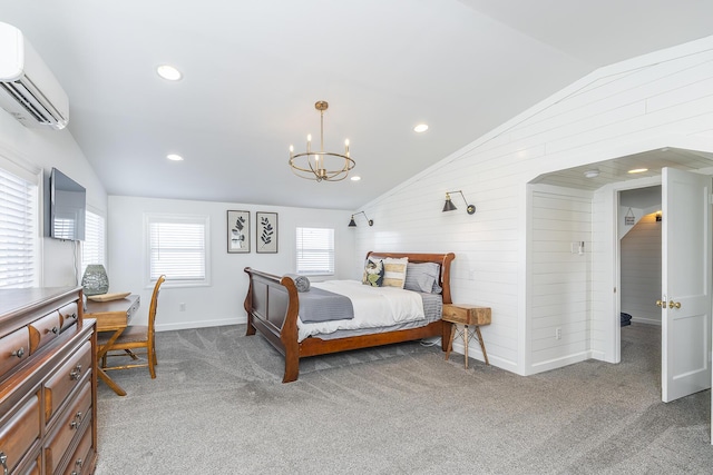 carpeted bedroom with baseboards, recessed lighting, vaulted ceiling, a wall mounted air conditioner, and a chandelier