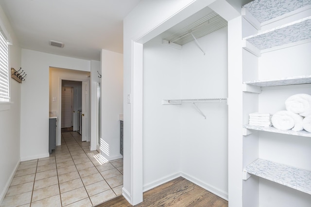 walk in closet featuring light tile patterned floors