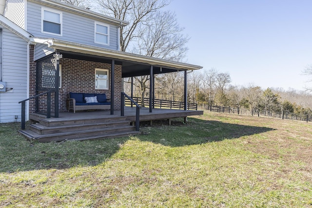 view of yard with an outdoor hangout area and fence