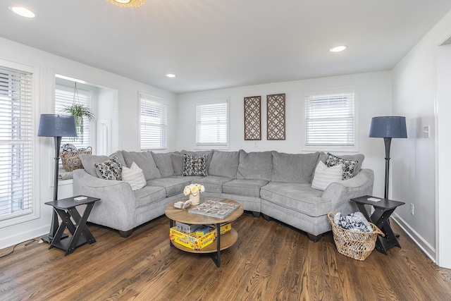 living room with recessed lighting, baseboards, and wood finished floors