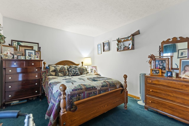 bedroom featuring baseboards, a textured ceiling, and carpet