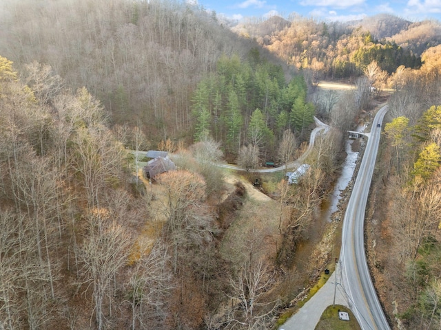 drone / aerial view featuring a forest view