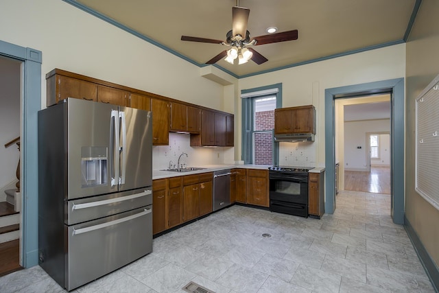 kitchen featuring a ceiling fan, under cabinet range hood, backsplash, stainless steel appliances, and light countertops