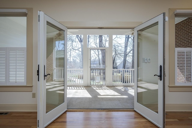 unfurnished sunroom with visible vents and french doors