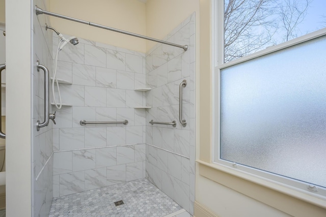 full bathroom with a tile shower