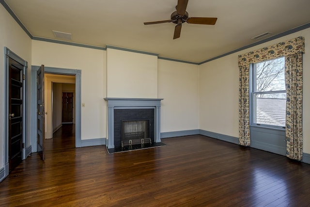 unfurnished living room featuring hardwood / wood-style floors, visible vents, ceiling fan, ornamental molding, and a brick fireplace